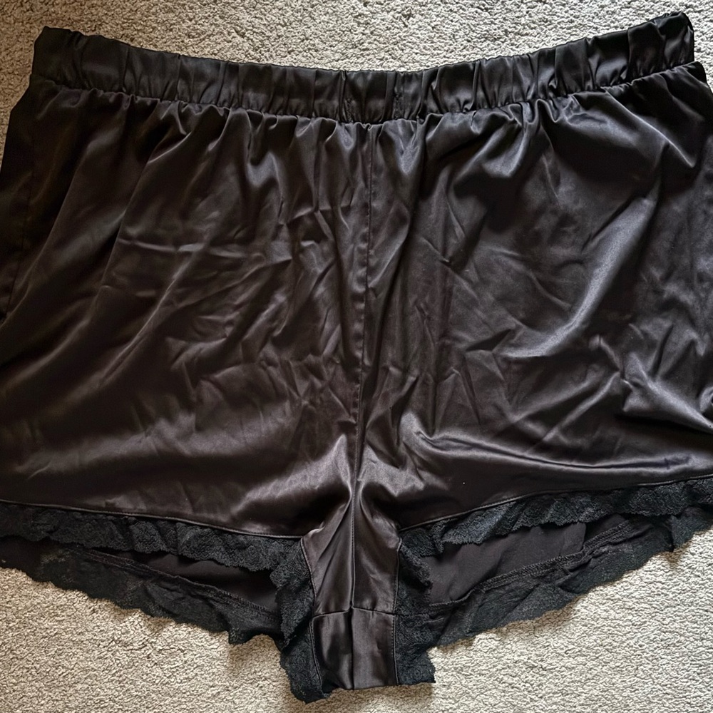 Black silk sleep shorts with lace trim